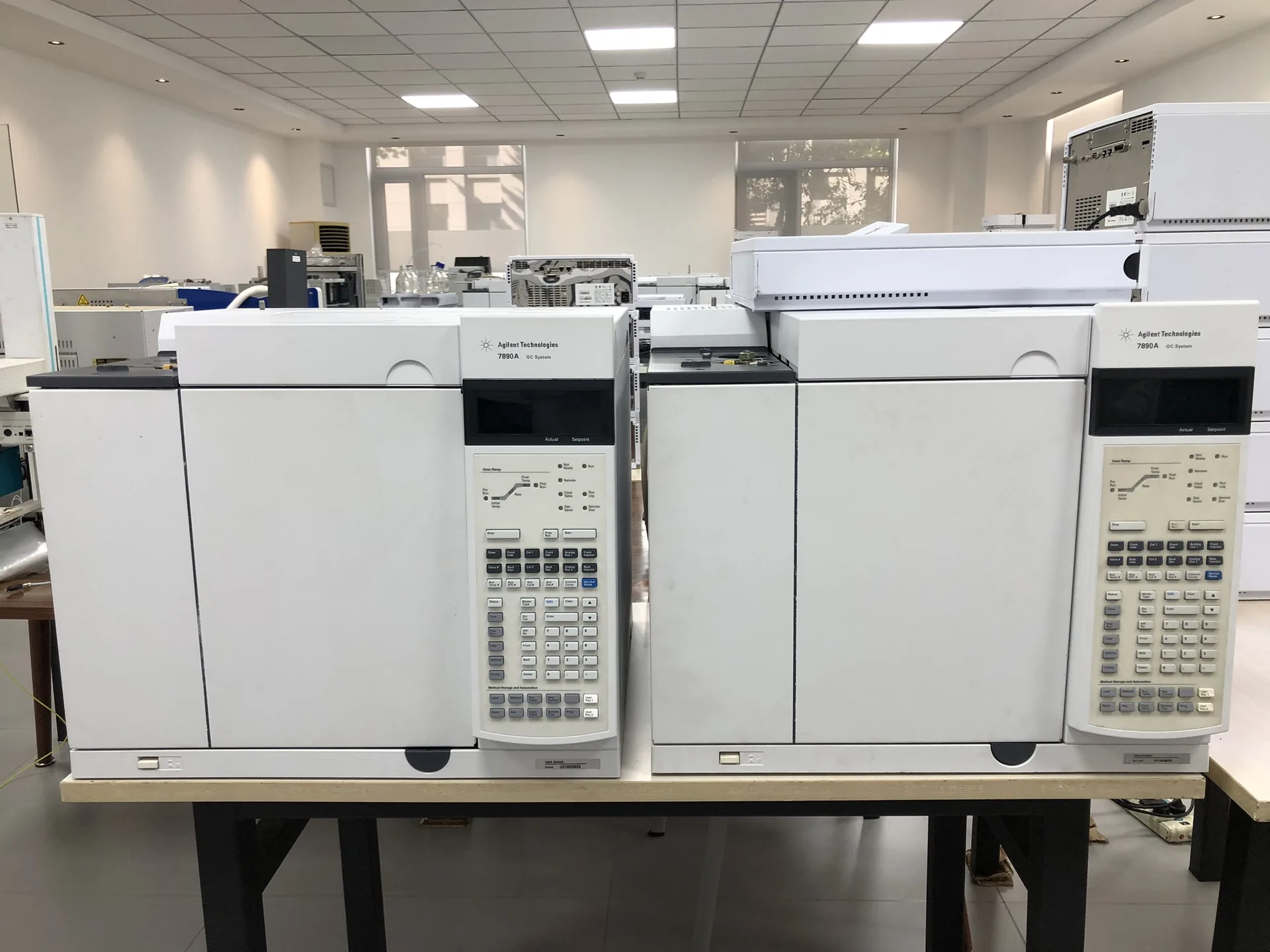 Two refurbished Agilent 7890A GC systems on a laboratory bench